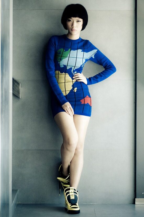 Female model studio photoshoot in blue outfit