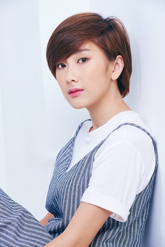 Female model studio close-up portrait in white