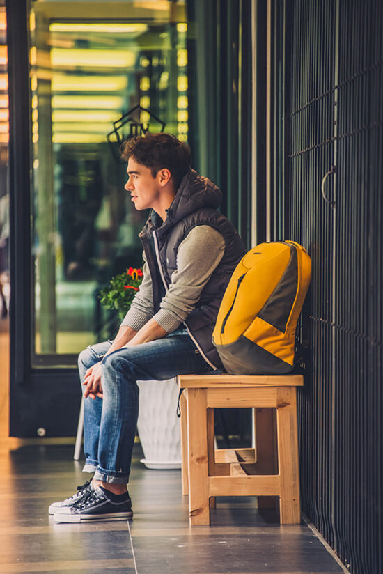 Male model sitting in lifestyle magazine photoshoot