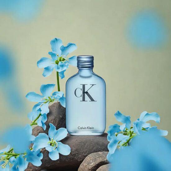 CK perfume bottle with floral decoration – lifestyle product shoot.