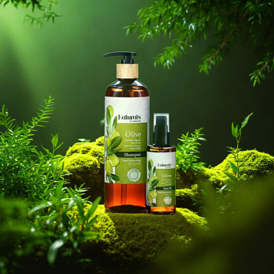 Naturals Shampoo bottle with green nature props – commercial product shoot.