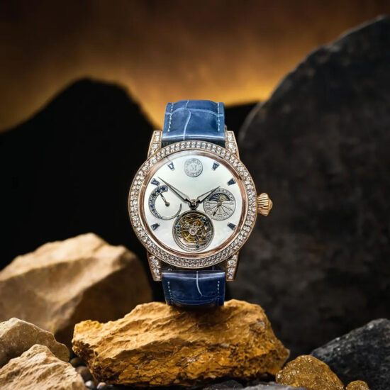 Silver wristwatch on golden stones – luxury product photography.
