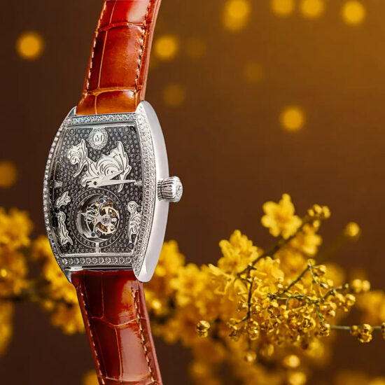 Luxury silver wristwatch with red leather strap – product showcase photography.