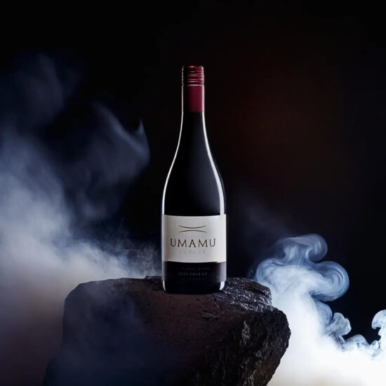 UMAMU Red wine bottles in smoky background – creative wine photography.