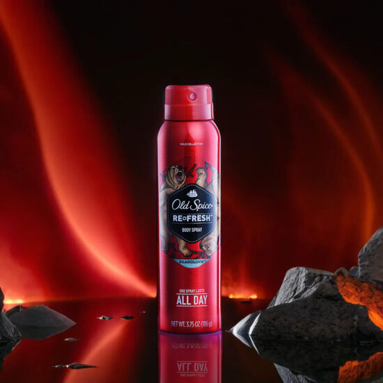 Old Spice Red Fresh bottle with vibrant red light backdrop – product photography.