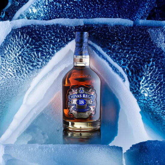 Chivas Whiskey bottle on ice cube background – product commercial photography.
