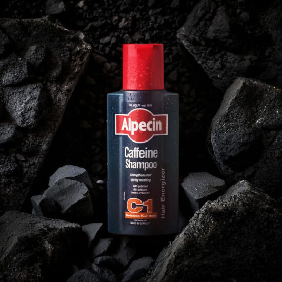 Men’s Shampoo bottle with dark rock background – masculine product photography.