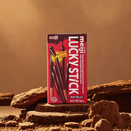 Meiji Lucky Sticks standing on rock surface with brown backdrop – foods product photography.