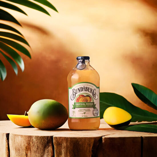 Mango Fruit juice bottle with tropical background – beverage product photography.