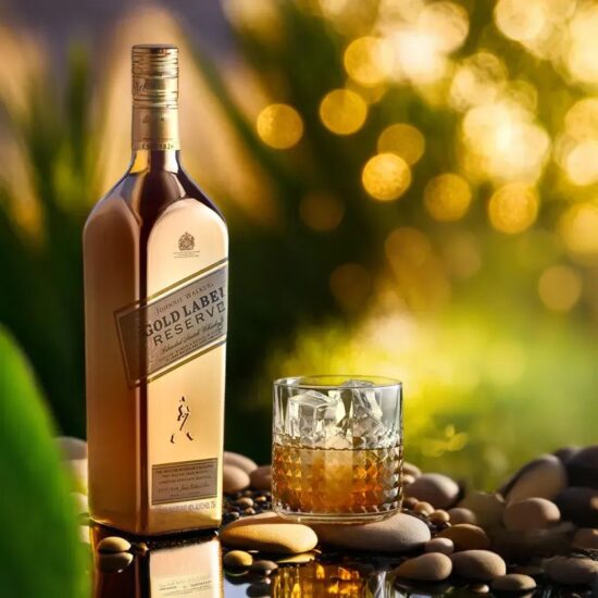 Premium whiskey bottle on rustic background with cactus decoration – professional product photography.