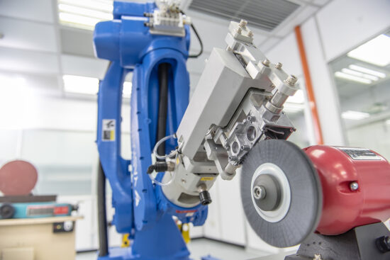 Industrial robotic arm working in manufacturing plant